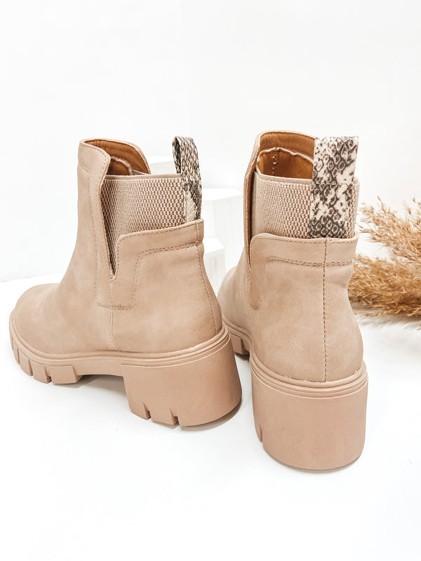 combat boot sole booties with elastic slip on feature and snakeskin pull tab 