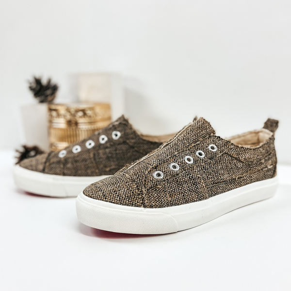 Brown tweed sneakers without laces with white sole. Pictured on white background.