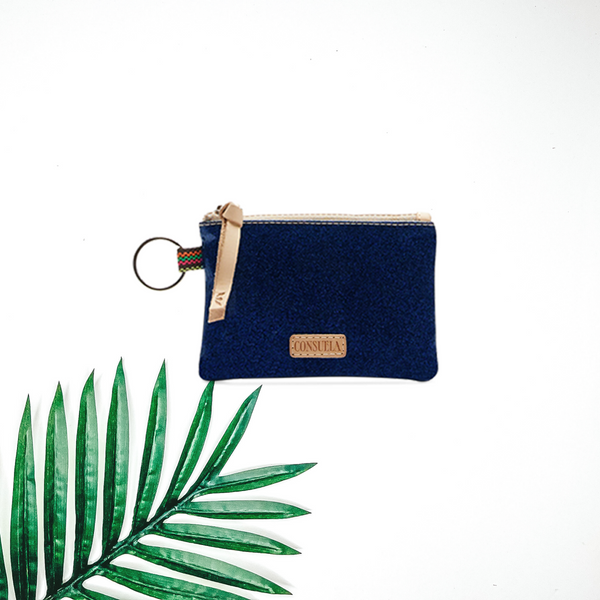 A blue glitter key chain pouch pictured on a white background with a palm leaf.