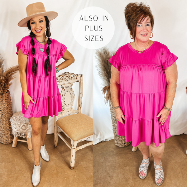 Models are wearing a pink tiered mini dress. SIze small model has it paired with white booties and a tan rancher hat. Plus size model has it paired with snakeskin sandals and gold jewelry.