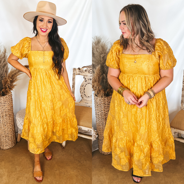 Models are wearing a square neck dress that is bright yellow. Size small model has it paired with an ivory hat, tan sandals, and silver jewelry. Size large model has it paired with black heels and gold jewelry.