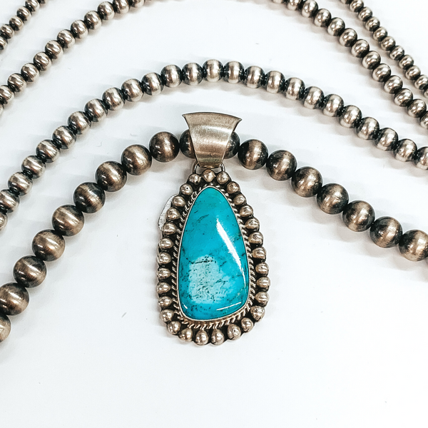 Augustine Largo | Navajo Handmade Sterling Silver Asymmetrical Pendant with Kingman Turquoise Stone