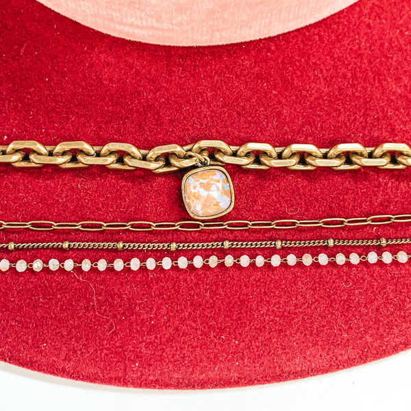 Pink Panache | Four Strand Crystal and Bronze Chain Necklace with AB Cushion Cut Crystal Drop