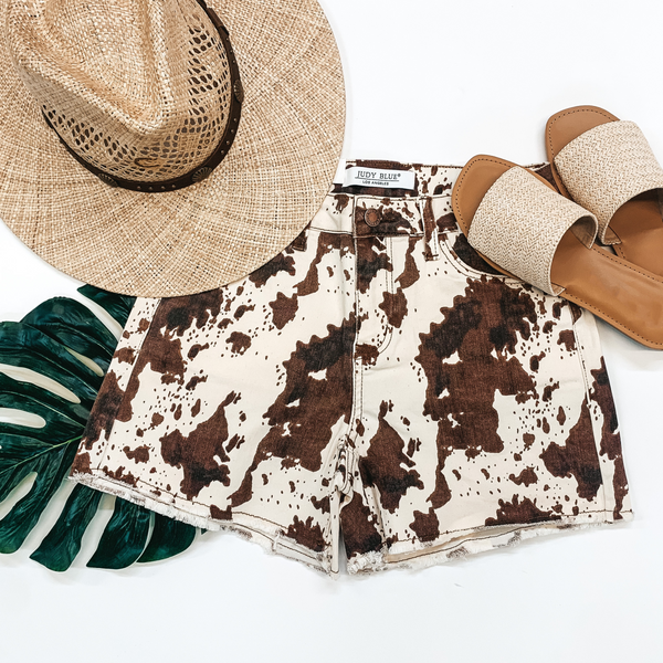 Judy Blue | Cow Town Cruise Raw Hem Shorts in Brown Cow Print